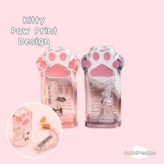 Pair of clear colored pink and black plastic sharpener shaped like a cat's paw