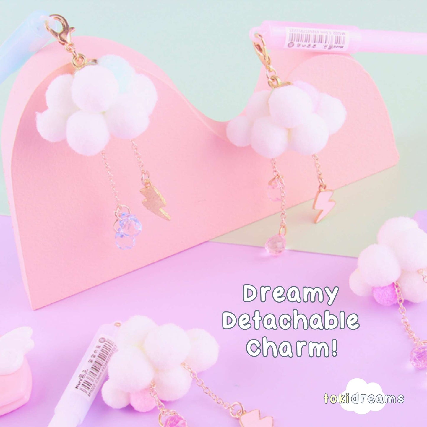 Collection of pens with cloud-shaped and a lightning bolt charm, surrounded by cloud decor