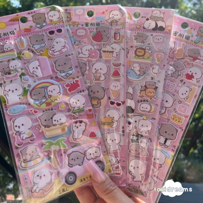 Hand holding Peach and Goma 3D sticker sheets
