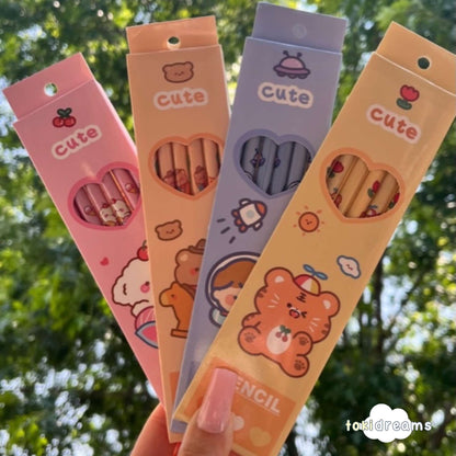 Hand holding four eco-friendly cartoon pencil packs together