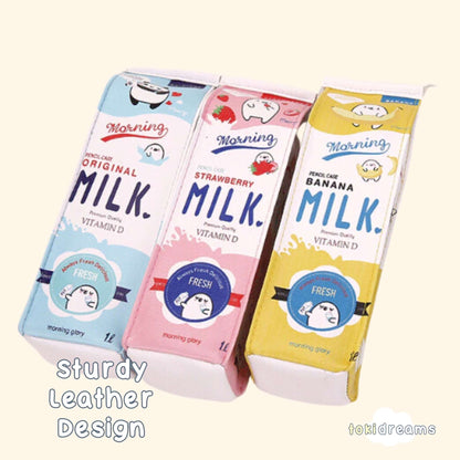 Three pencil pouches with cartoon animal designs, resembling a milk carton, in strawberry, banana, and blue colors.