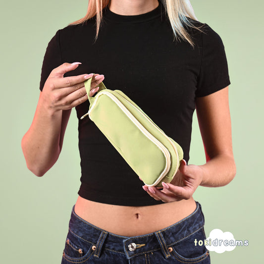 girl holding a green expandable organizer case 
