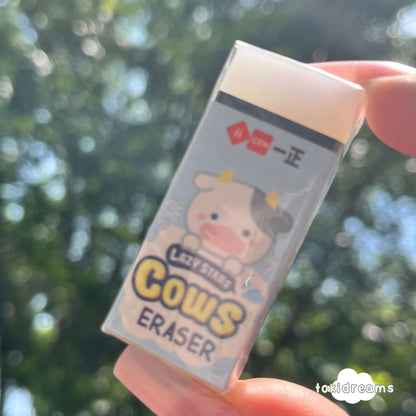 Hand holding rectangle clear rubber eraser
