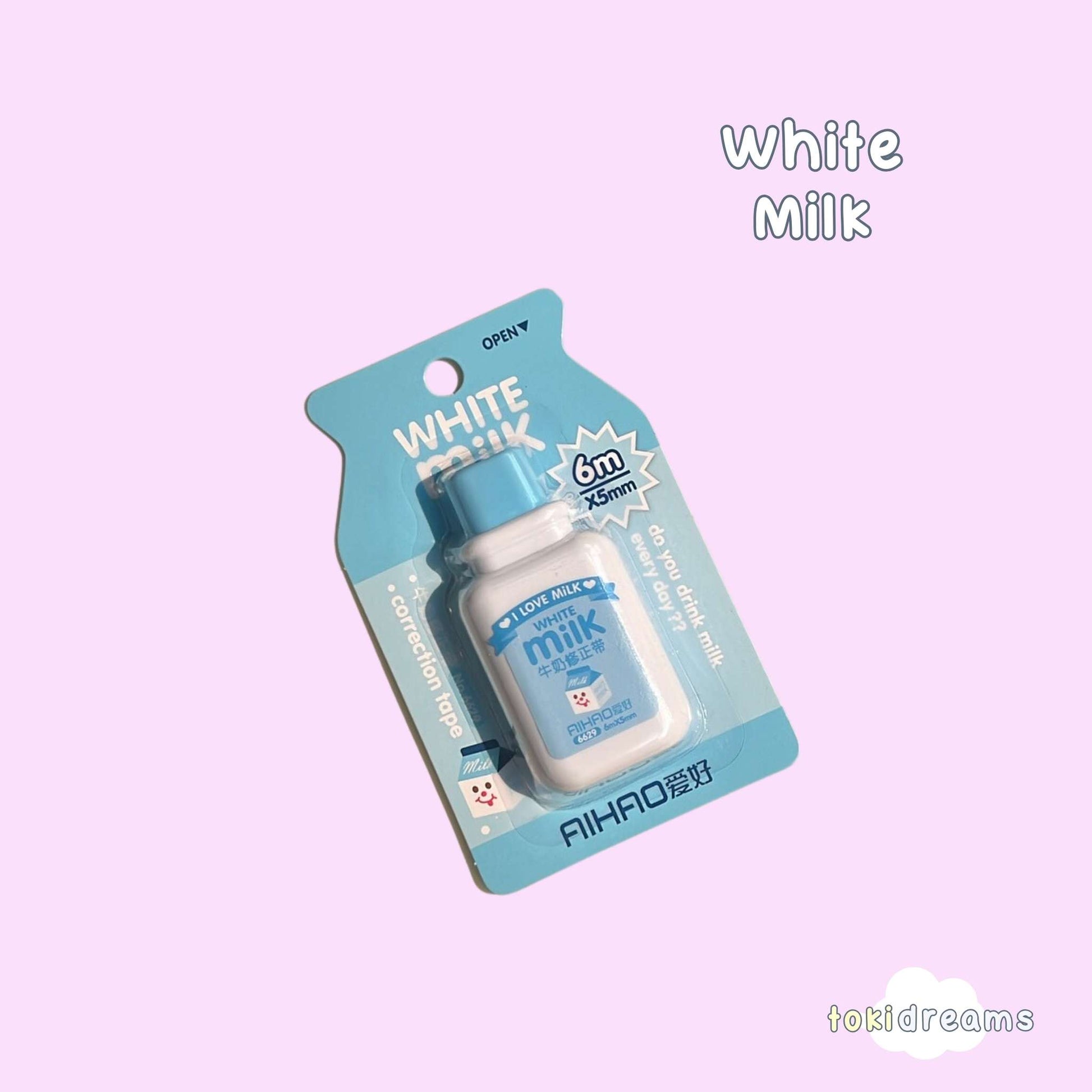 Correction tape in original milk bottle packaging with product visible through clear window