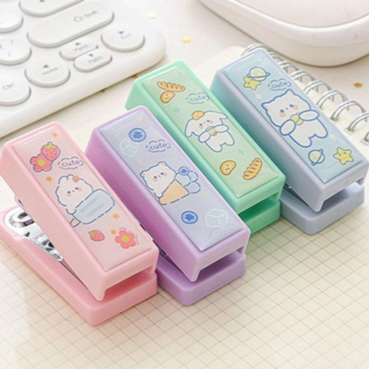 pocket sized mini staplers in pastel pink, purple, green and blue color with kawaii cartoon bear illustration