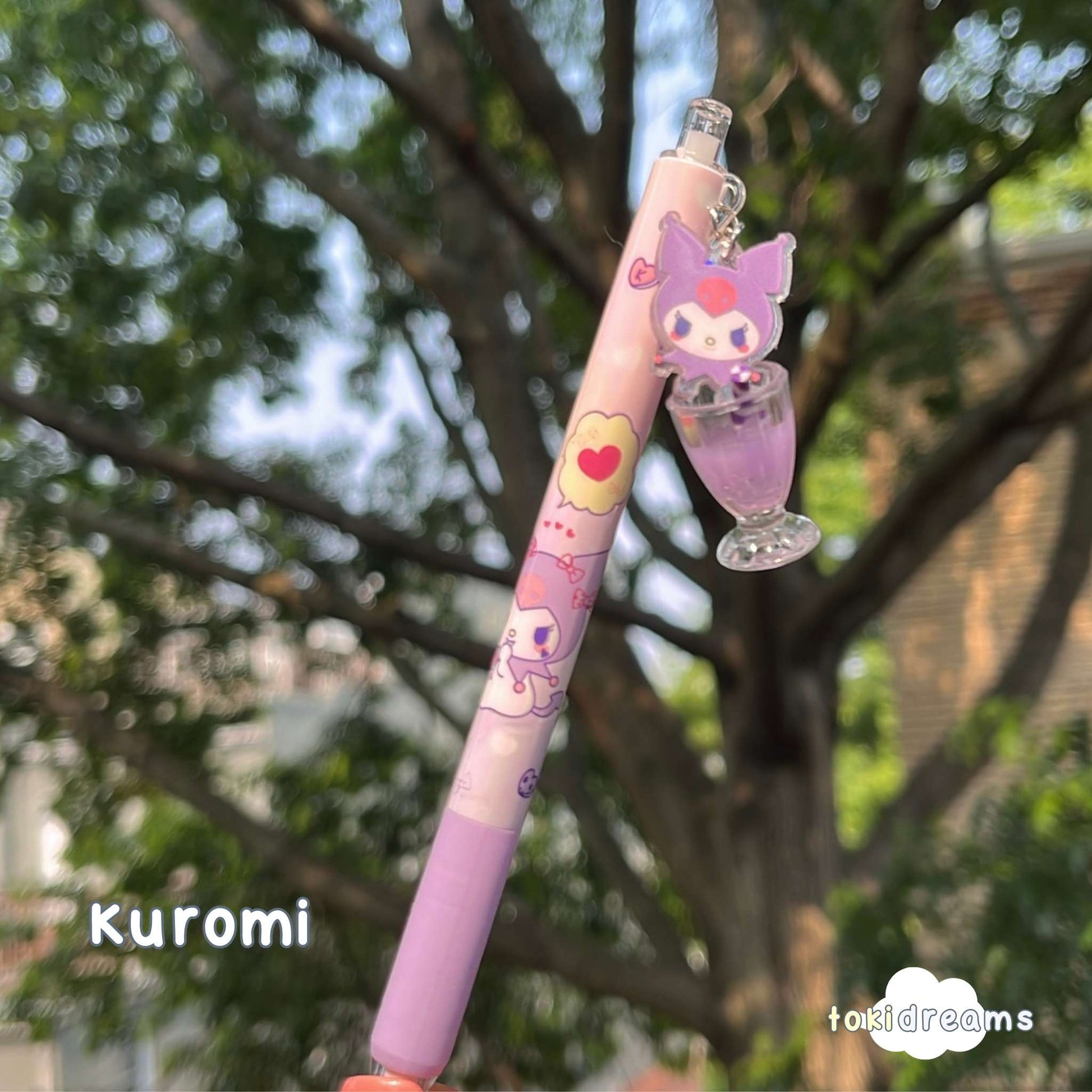 Purple pen with swinging Kuromi Sanrio character and drink cup with straw charm