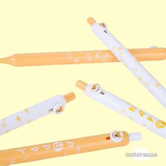 5 Shiba Inu gel pens with sliding dog charms on orange background